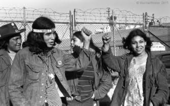 Minority rights activists raising their hands during a protest in the United States