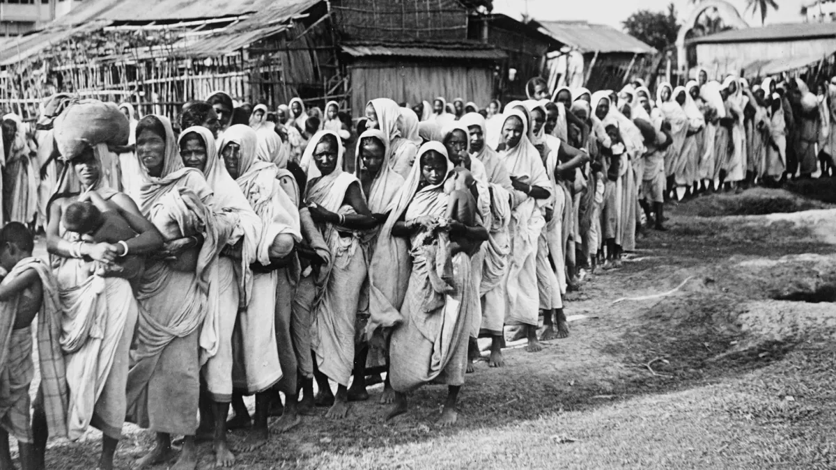 A long queue of Bengali women and children waiting at a relief station during the Bengal Famine of 1943
